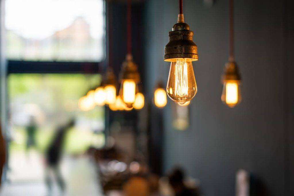 Warm White Light Bulb In Industrial-Style Building Interior
